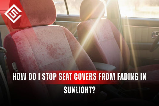Faded red car seat covers exposed to sunlight through windshield showing UV damage that causes seat covers to fade.